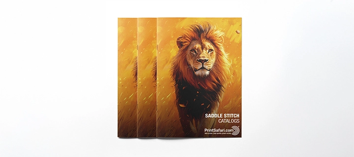 Image of a saddle-stitched catalog with a yellow cover featuring a male lion.