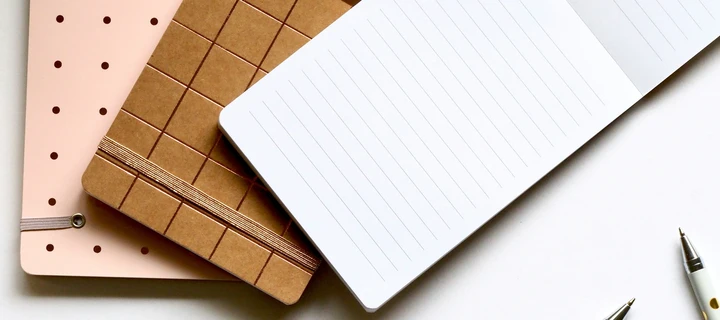 Multiple Paper Bags laying on a table photographed from a top-view